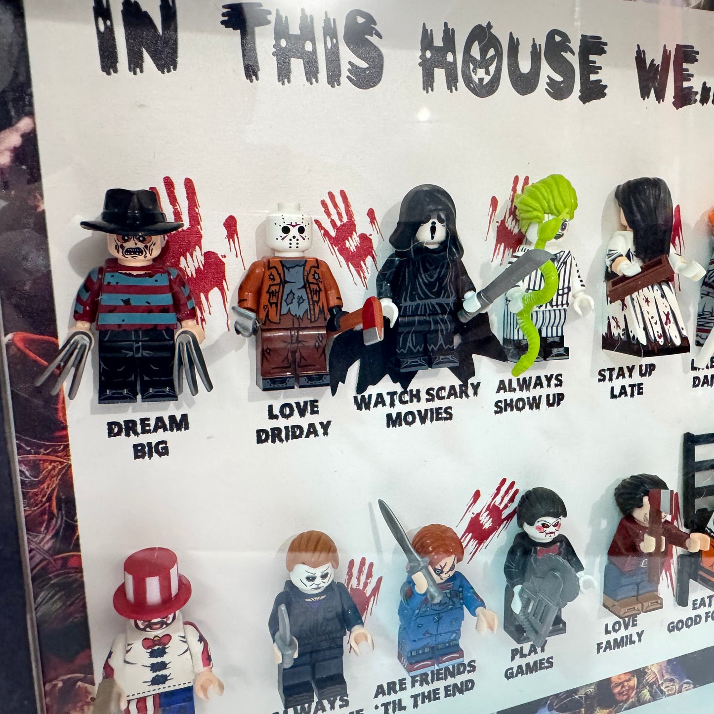 Display of LEGO figures with themed accessories and text on a white background