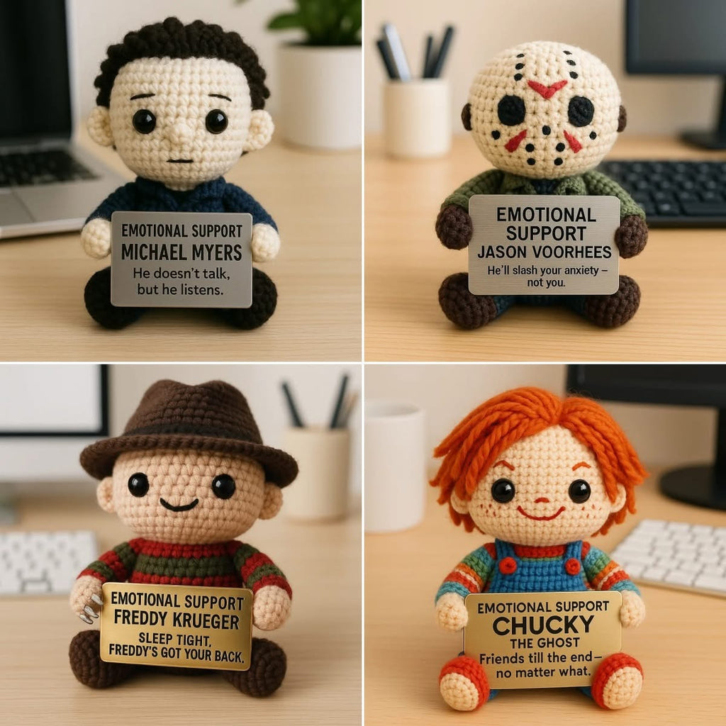 Four emotional support plush toys with signs on a desk.