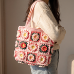 Pink granny square crochet flower tote bag - carried over the shoulder