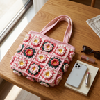 Pink granny square crochet flower tote bag - size reference with phone, sunglasses and book