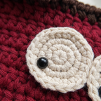 Red crochet cherry crossbody bag - macro eye and stitch detail