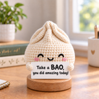 Emotional Support Dumpling Crochet Doll - sign reads Take a BAO, you did amazing today!